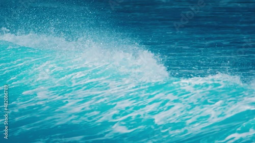 Ocean wave breaks on the shore in Maldives