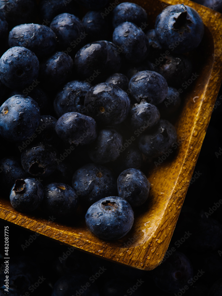macro photography. Fresh blueberries in a yellow bowl. Useful product, vitamins, diet food. Medicine, cooking. Restaurant, cafe, hotel, advertising, banner.