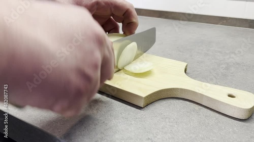 italian man cutting an onion