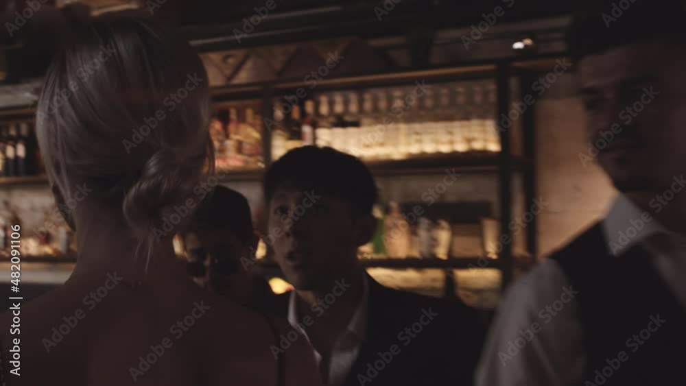Woman Walking In To Bar As Men Stare At Her Woman Walking In To Bar As Men Stare At Her