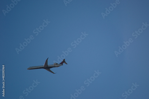 Plane in blue sky © Elliot