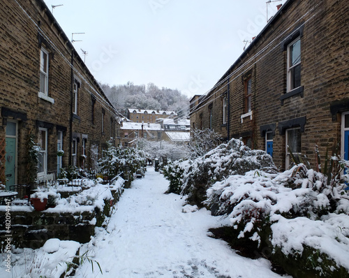 traditional west yorkshire terraced houses with snow on the ground in hebden bridge west yorkshire photo