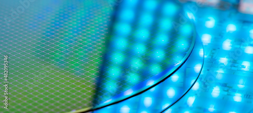 Fotografie Silicon Wafers with microchips used in electronics for the fabrication of integr