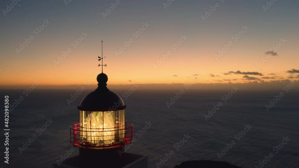Panoramic aerial view of the lighthouse with the ocean in the background at sunset