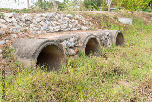  Concrete pipe,   Dried drain outlet during the summer heatwave. © pornsawan