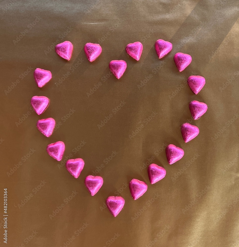 pink chocolates creating a heart pink chocolates creating a heart