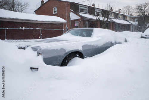 Toronto, Ontario / Canada - January 17, 2022 - Toronto St Clair West car covered with snow on day of snowstorm