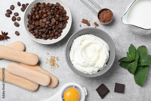 Flat lay composition with ingredients for tiramisu on grey table