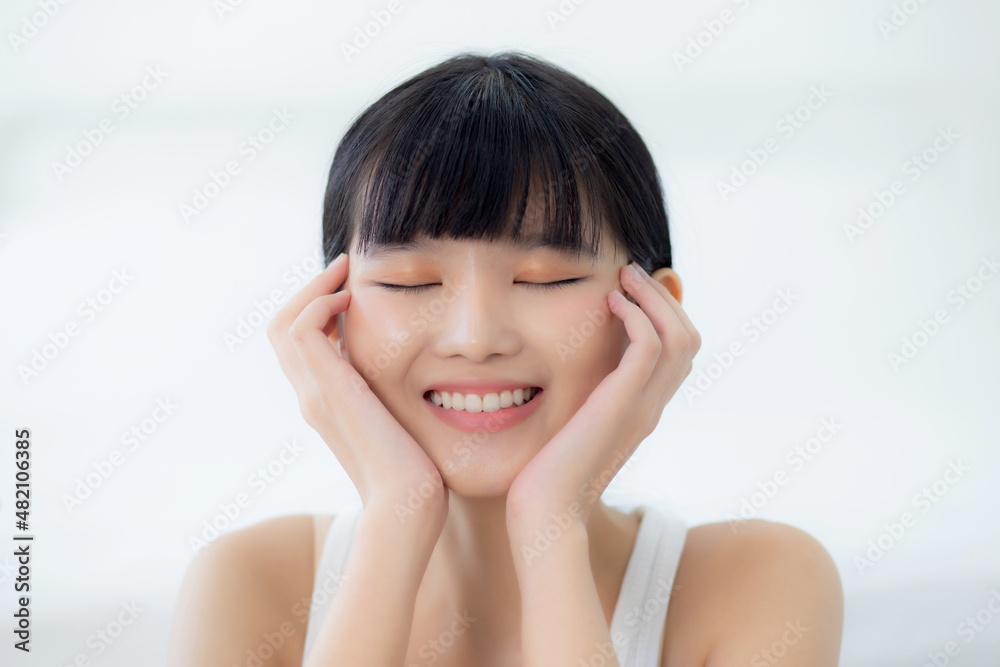 Beautiful young asian woman makeup of cosmetic, girl hand touch cheek on face and smiling attractive, facial of beauty perfect skincare with wellness and wrinkle, skin care and health concept. Beautiful young asian woman makeup of cosmetic, girl hand touch cheek on face and smiling attractive, facial of beauty perfect skincare with wellness and wrinkle, skin care and health concept.