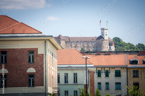 Outlook tower, also called viewing tower or Razgledni stolp, taken from downhill in Ljubljana castle with the flag of the city. The fortress is the symbol of Ljubljana, capital city of Slovenia photo