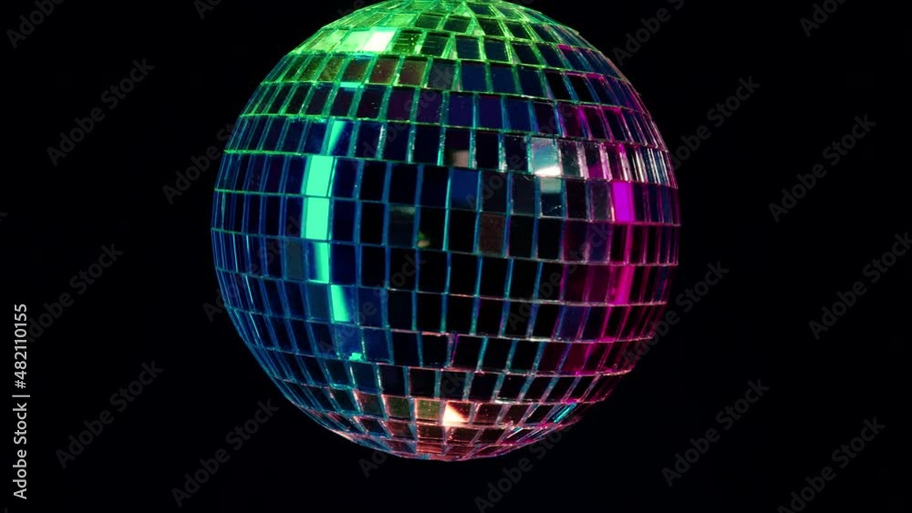 Disco mirror ball spinning under neon. Glossy silver sphere reflecting light. Retro night party, music and entertainment concept background Disco mirror ball spinning under neon. Glossy silver sphere reflecting light. Retro night party, music and entertainment concept background