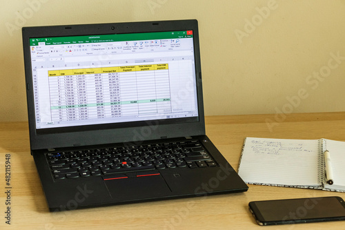 Shot of an excel sheet on computer screen showing bank loan amortization table. Accounting