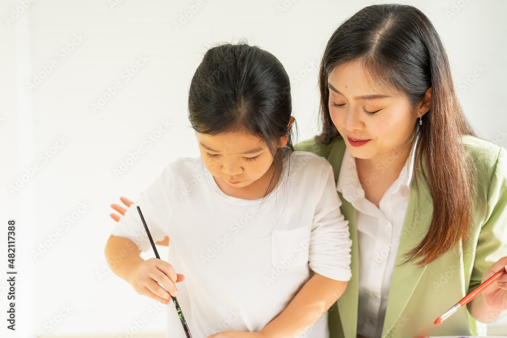 cute little children intend to learn painting color with teacher in education classroom with copy space. asian beautiful children happy and fun color painting education in small school cute little children intend to learn painting color with teacher in education classroom with copy space. asian beautiful children happy and fun color painting education in small school