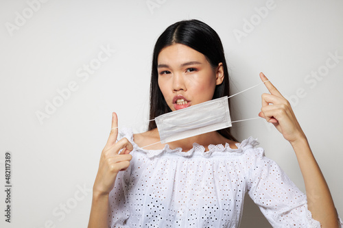 pretty brunette face shield safety close-up isolated background unaltered photo