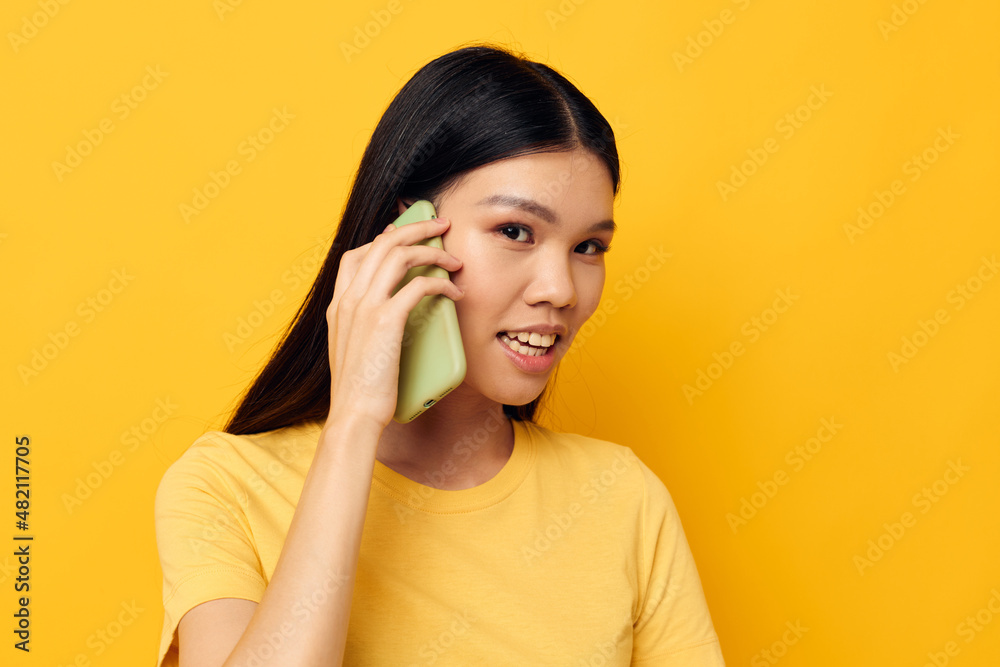 woman with Asian appearance phone communication fun use studio model unaltered