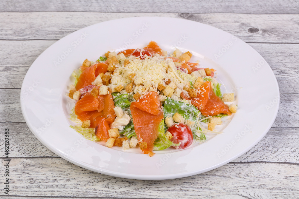 Caesar salad with salmon and parmesan