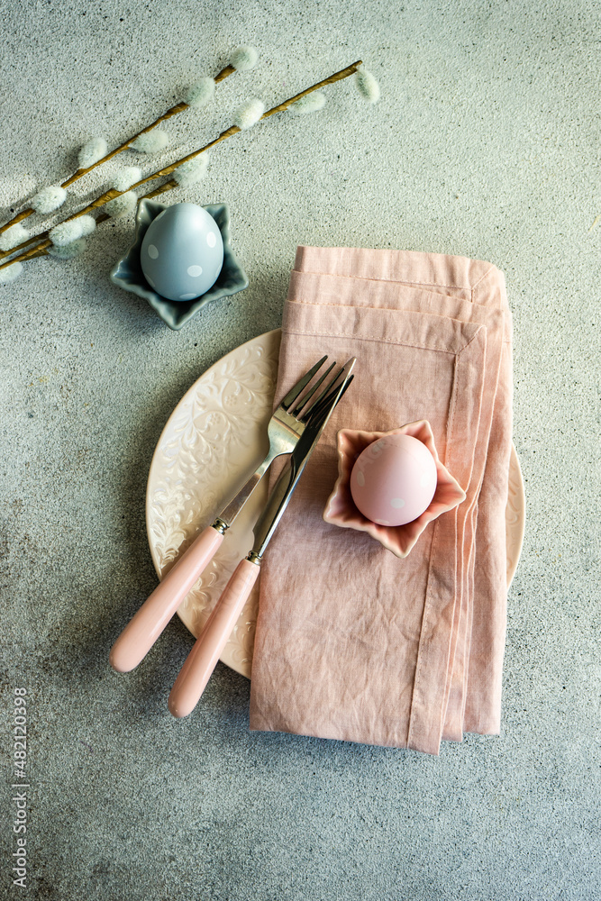Festive Easter place setting decorated with eggs Festive Easter place setting decorated with eggs