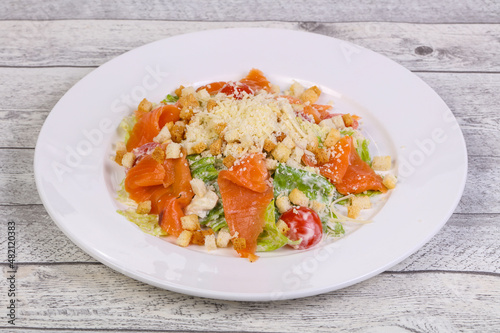 Caesar salad with salmon and parmesan