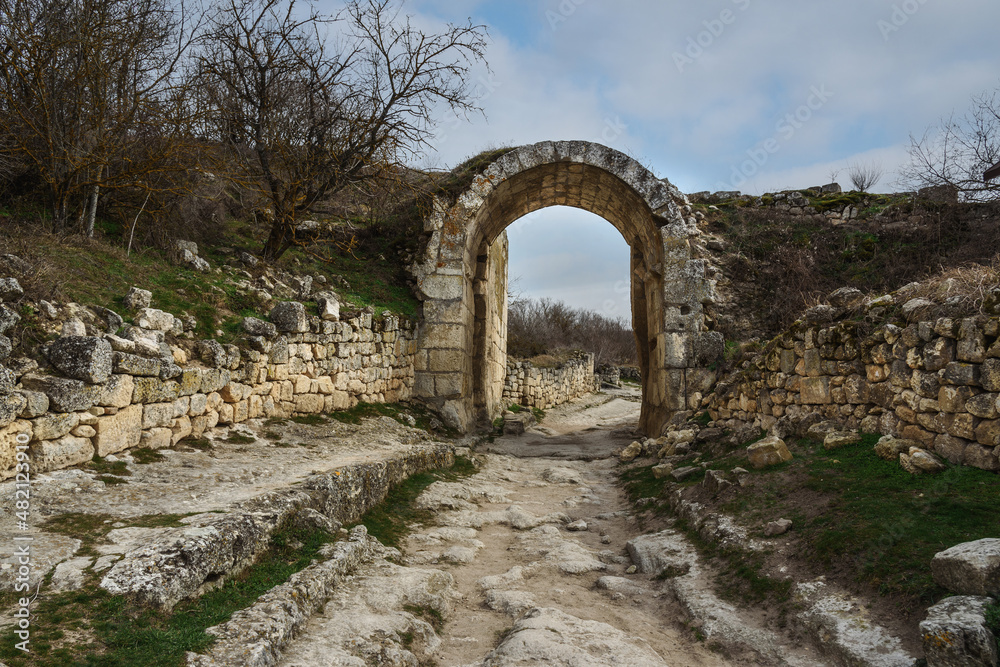The central defensive wall with Orta Kapu Gate in cave city Chufut-Kale in Bakhchysarai, Crimea