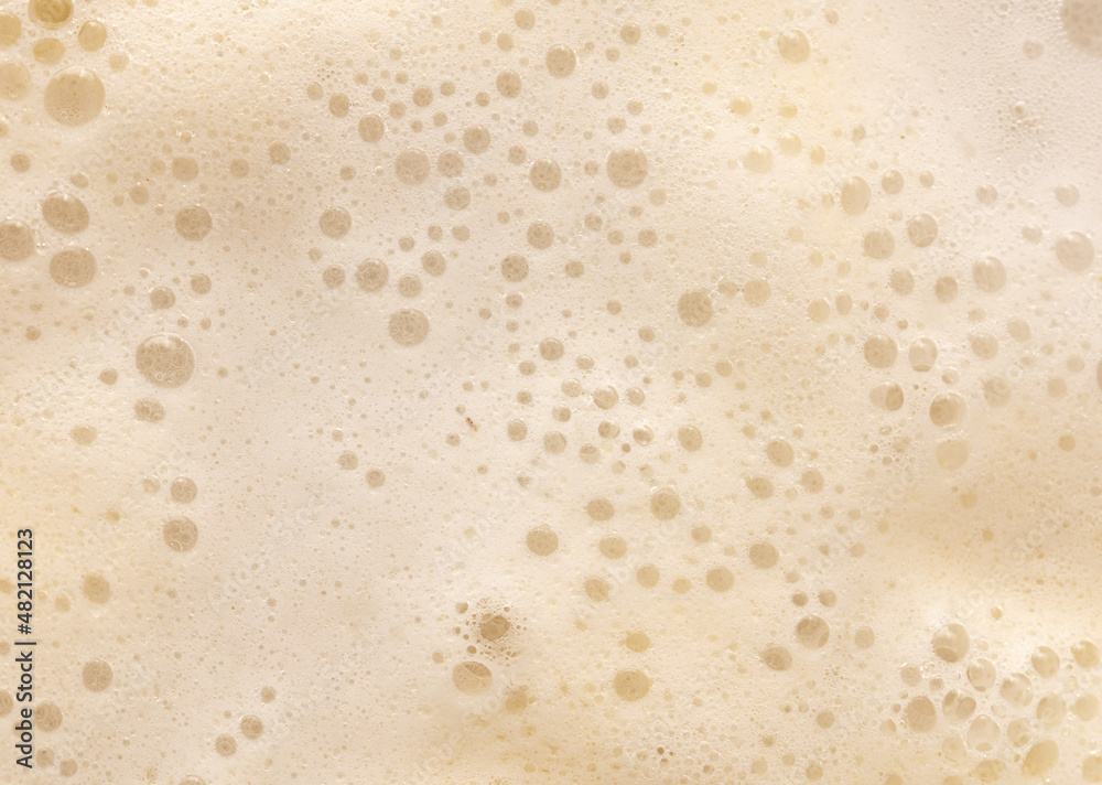 White foam in boiling water as an abstract background. White foam in boiling water as an abstract background.