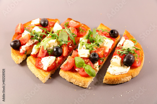 bruschetta or tapas, toast with tomato, mozzarella and basil