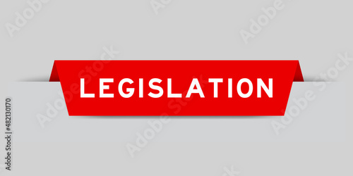Red color inserted label with word legislation on gray background