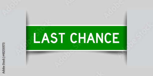 Inserted green color label sticker with word last chance on gray background