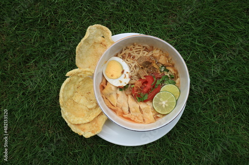 A bowl of Soto or Soup. Soto is a traditional soup consisting mainly of broth, meat and vegetables.