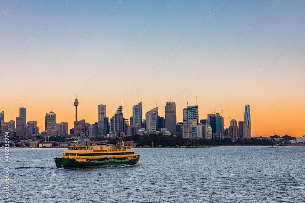 A Sydney Harbour Ferry heading towards Circular Quay at dawn.  Sydney, Australia.