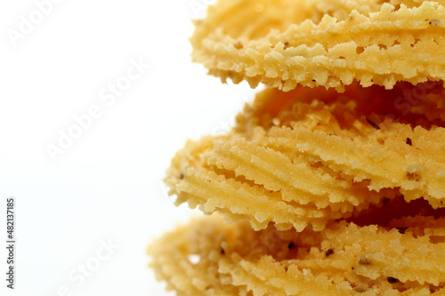 Murukku is a popular South Indian fried snack made with rice flour, lentil flours, spices and seasonings