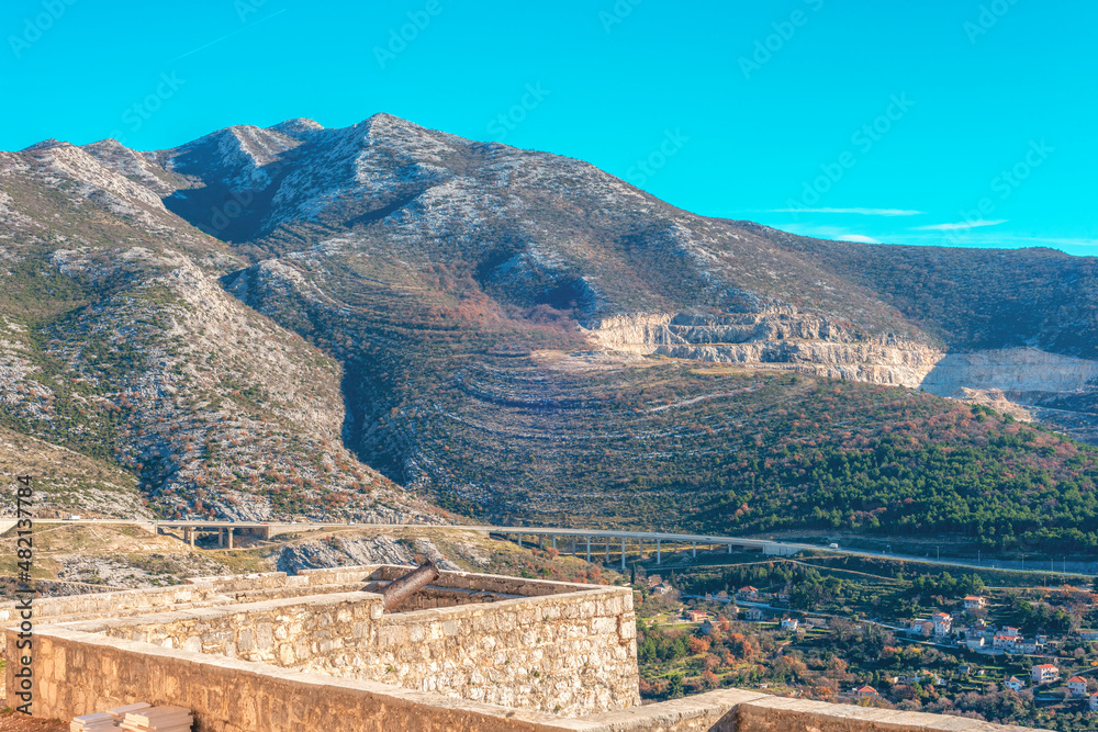 Scenic view from Klis fortress to the village and mountains, Croatia