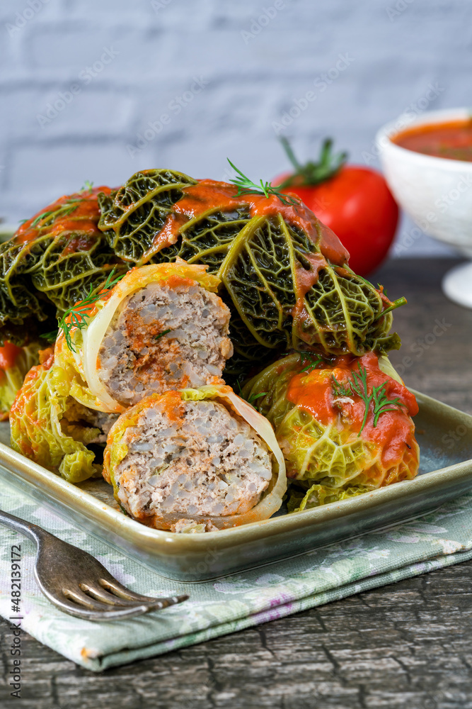 Gołabki - classic Polish dish of cabbage rolls stuffed with pork and rice in tomato sauce Gołabki - classic Polish dish of cabbage rolls stuffed with pork and rice in tomato sauce
