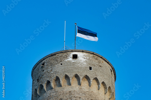 Obraz na plátně Estonian national blue black white flag waving on top of Tall Hermann tower in T