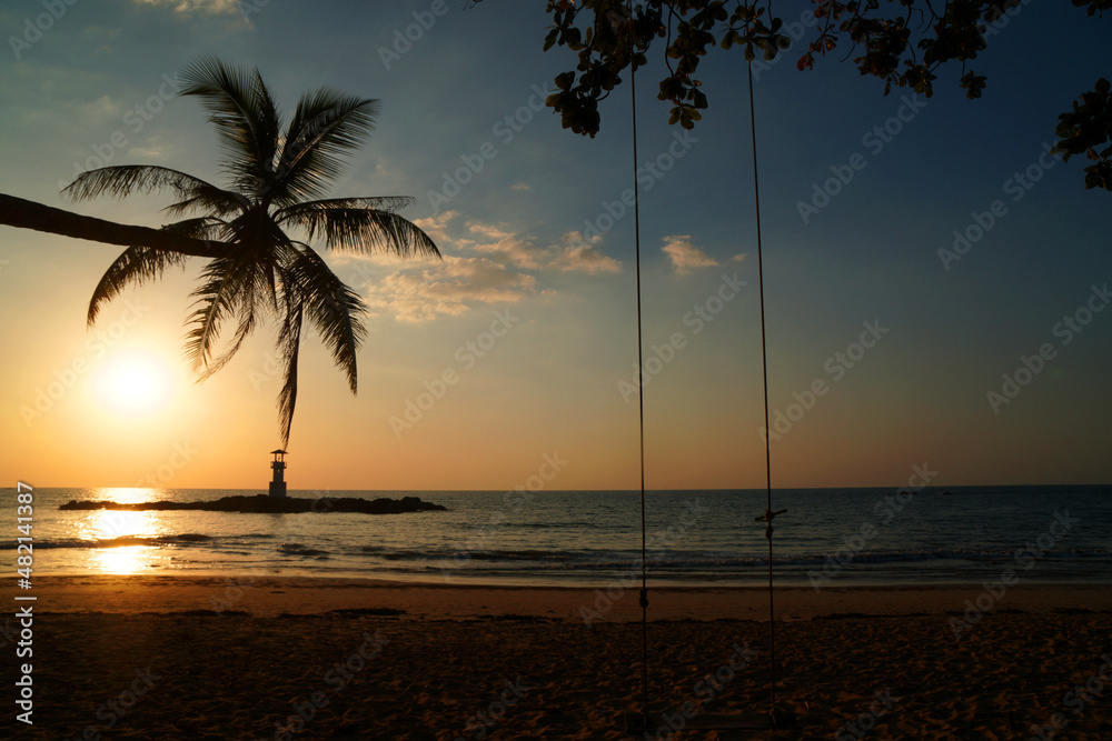 Landscape nature sunset and red  twilight sky with Silhouette  lighthouse coconut tree at Nang Thong Beach at Khao Lak Phang Nga Thailand - Seascape chill vibe on the beach - beautiful sky  