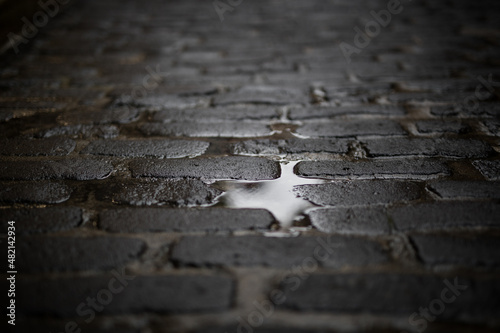 Photos Laneway pavers bricks road cobble stones wet puddle rain water reflection patter