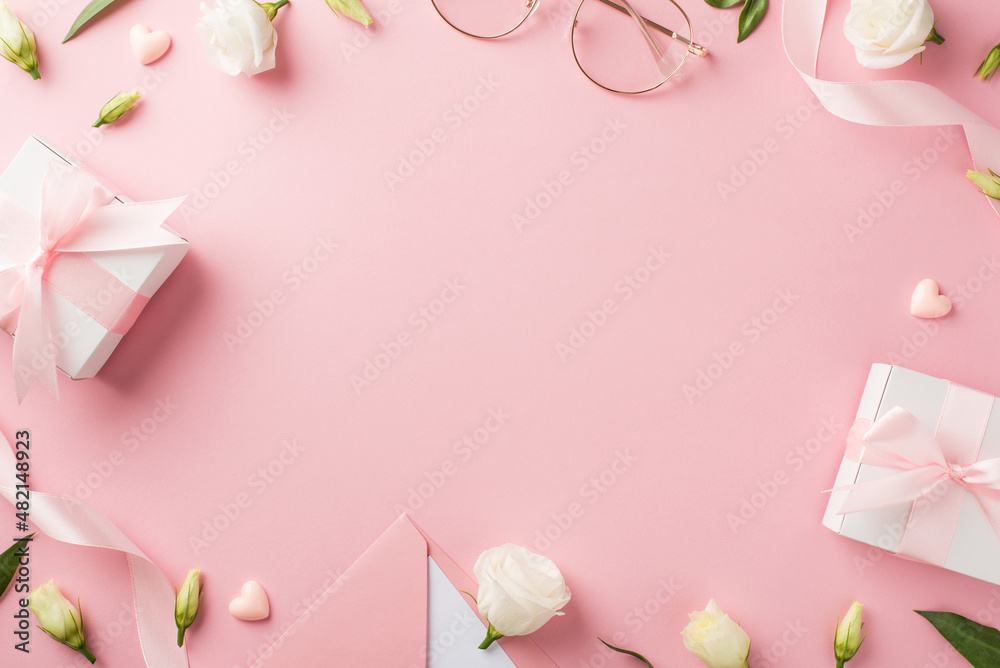 Top view photo of woman's day composition gift boxes pink ribbon envelope with letter stylish glasses hearts and prairie gentian flowers on isolated pastel pink background with copyspace in the middle