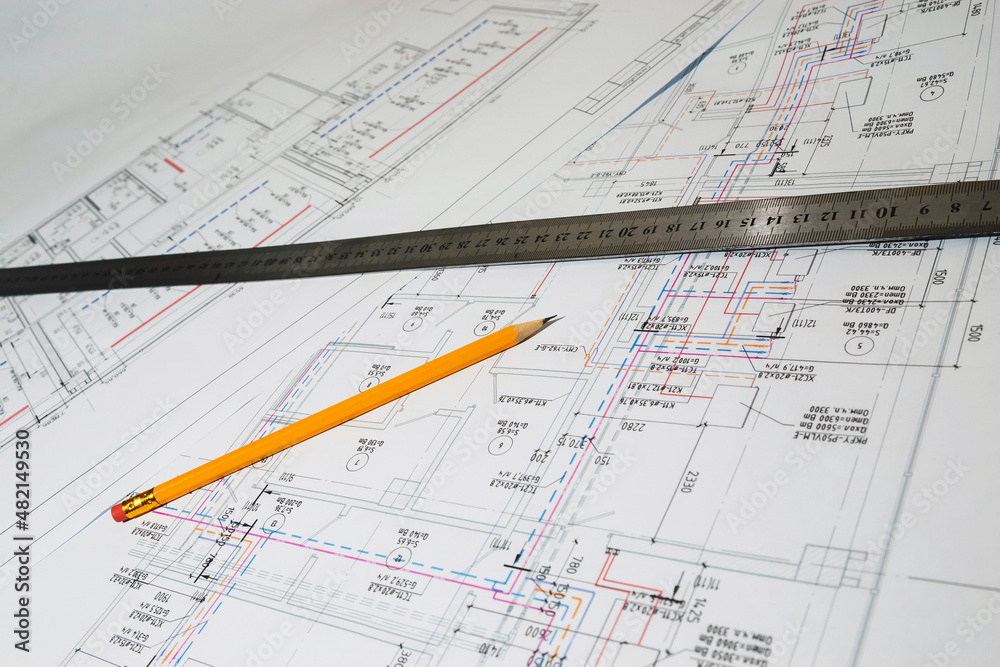 Engineering drawings in close-up. Engineering drawings with a ruler and pencils. Engineering drawings in close-up. Engineering drawings with a ruler and pencils.
