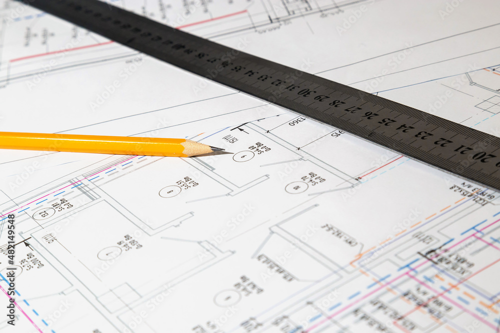 Engineering drawings in close-up. Engineering drawings with a ruler and pencils. Engineering drawings in close-up. Engineering drawings with a ruler and pencils.