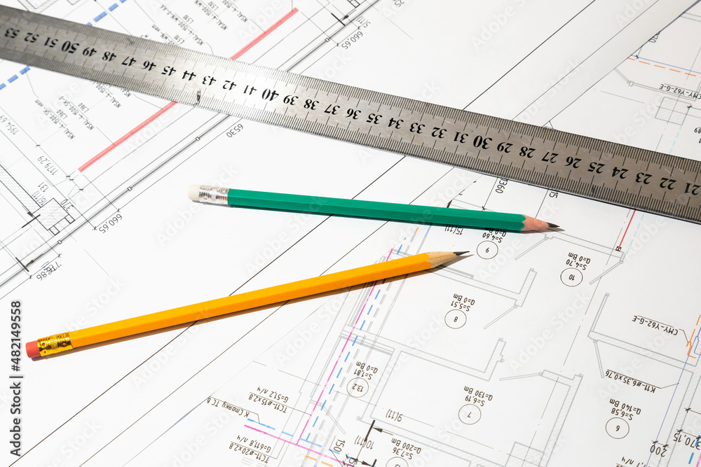 Engineering drawings in close-up. Engineering drawings with a ruler and pencils. Engineering drawings in close-up. Engineering drawings with a ruler and pencils.