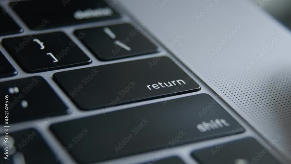Finger presses the Return Button on laptop keyboard once or several times Finger presses the Return Button on laptop keyboard once or several times