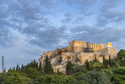 View of the city of Athens November 17, 2021: Evening landscape, blue sky with clouds, soft light. Picturesque view from the hill to the old town.