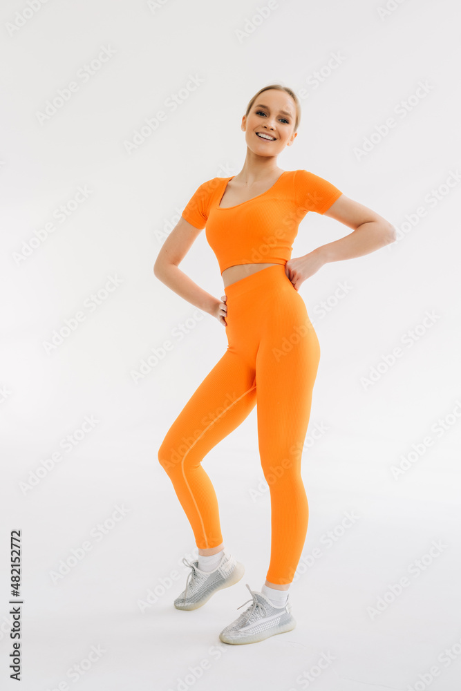 Powerful. Caucasian professional female athlete training isolated on white studio background. Muscular, sportive woman. Concept of action, motion, youth, healthy lifestyle.