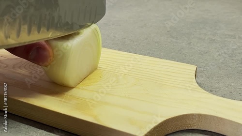 italian man cutting an onion slow motion