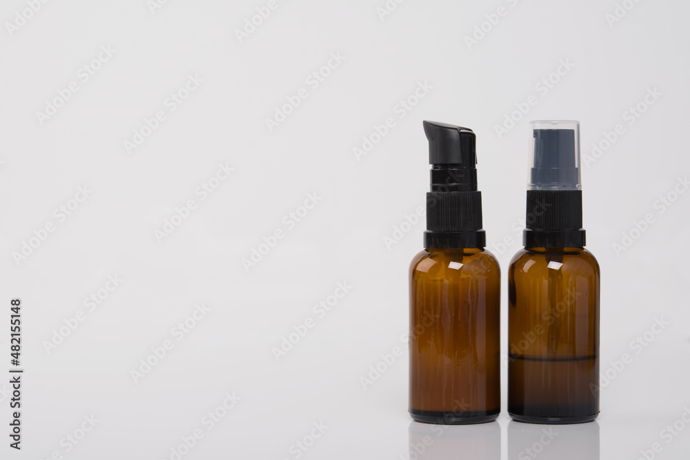on a white background, with a place for an inscription, two bottles of massage oil