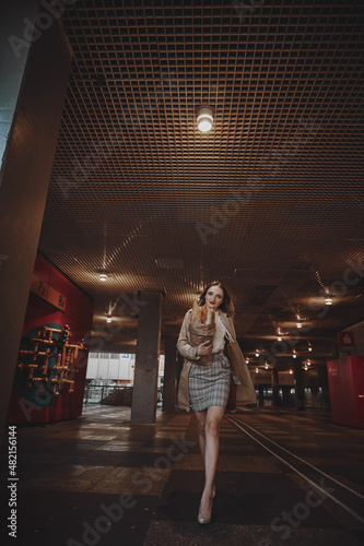 girl walks around the city French baguette in her hands