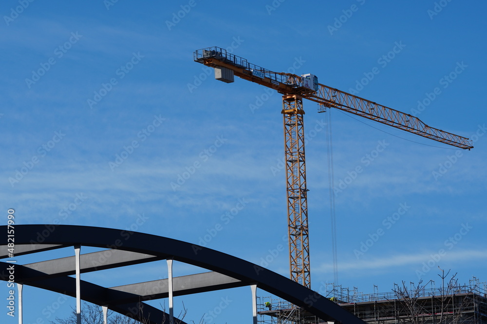 Crane in front of blue sky on a sunny day