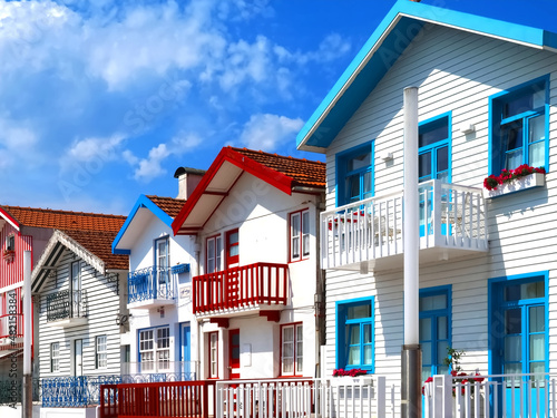 Colorful striped wooden beach houses at the promenade of Costa Nova, Aveiro, Portugal