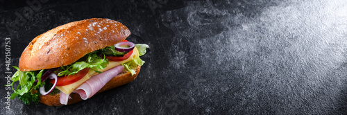 Tableau sur toile Sandwich with cheese and ham and fresh vegetables