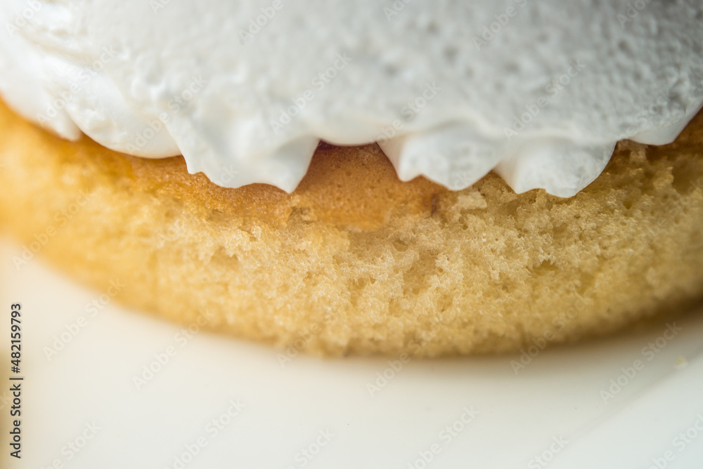 close up cake layer with white cream onto focusing on the center close up cake layer with white cream onto focusing on the center
