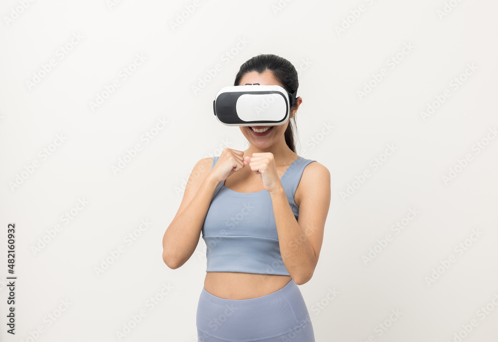 Training boxing with virtual sport on isolated background. Young asian sport woman wearing sportswear workout with simulated world. Into the future digital cyber universe. Future technology vr. Training boxing with virtual sport on isolated background. Young asian sport woman wearing sportswear workout with simulated world. Into the future digital cyber universe. Future technology vr.